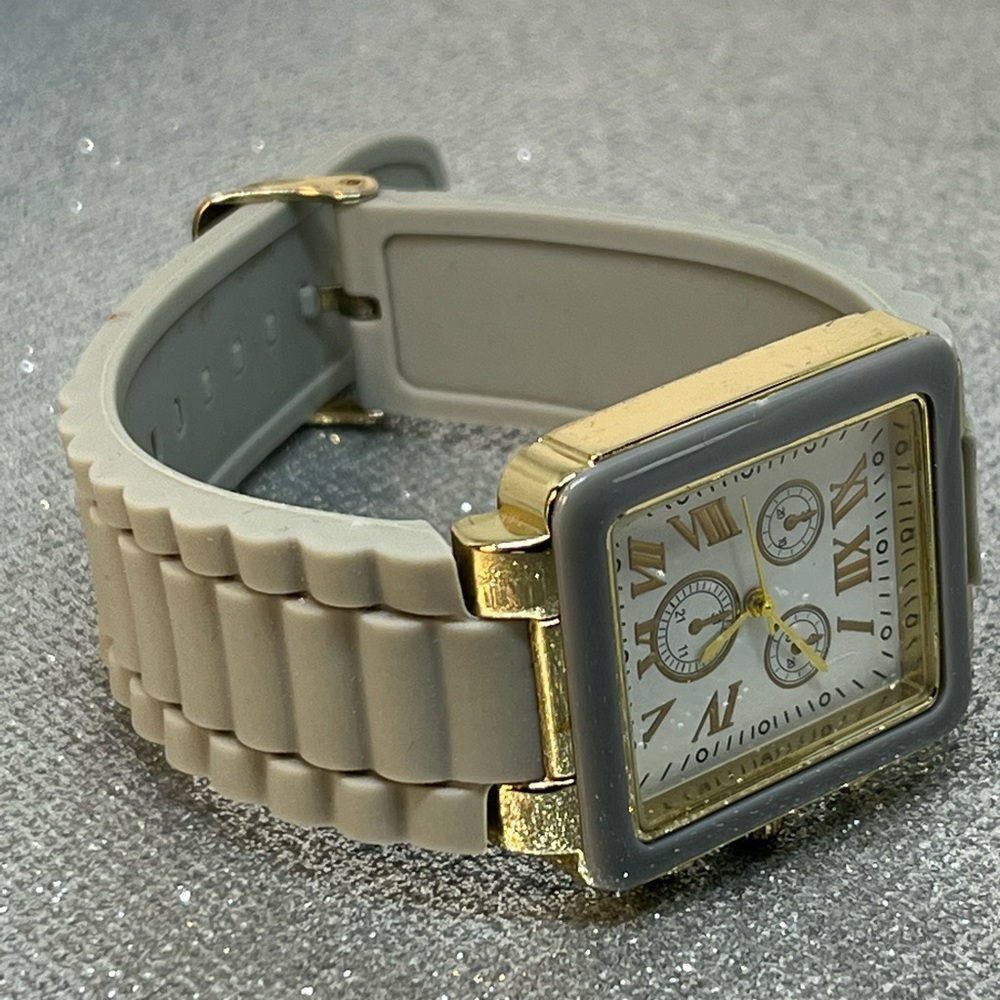This is a beautiful, gold and gray tone unbranded watch! with a silicone band!